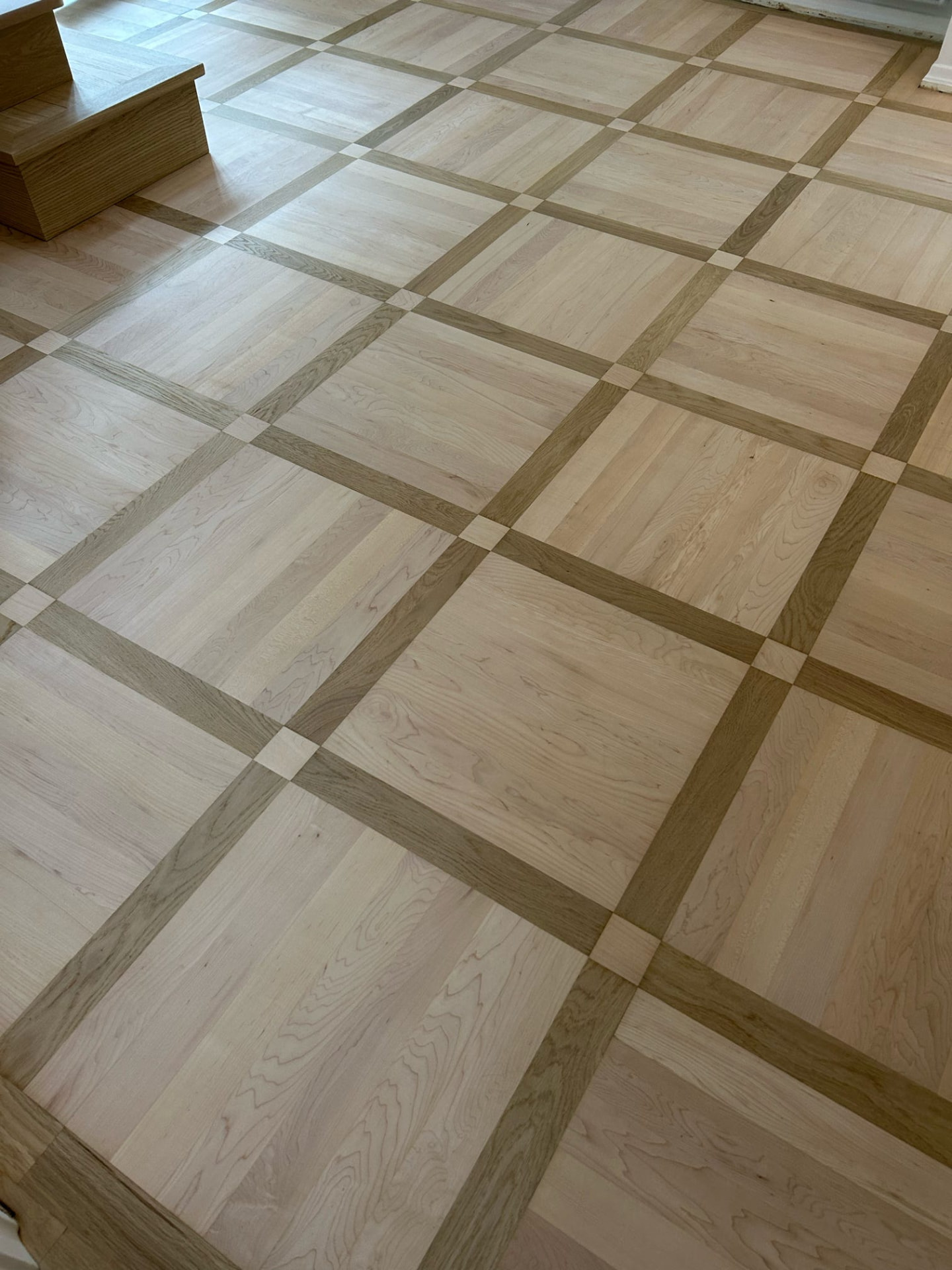 Elegant parquet floor with contrasting border and panel detail