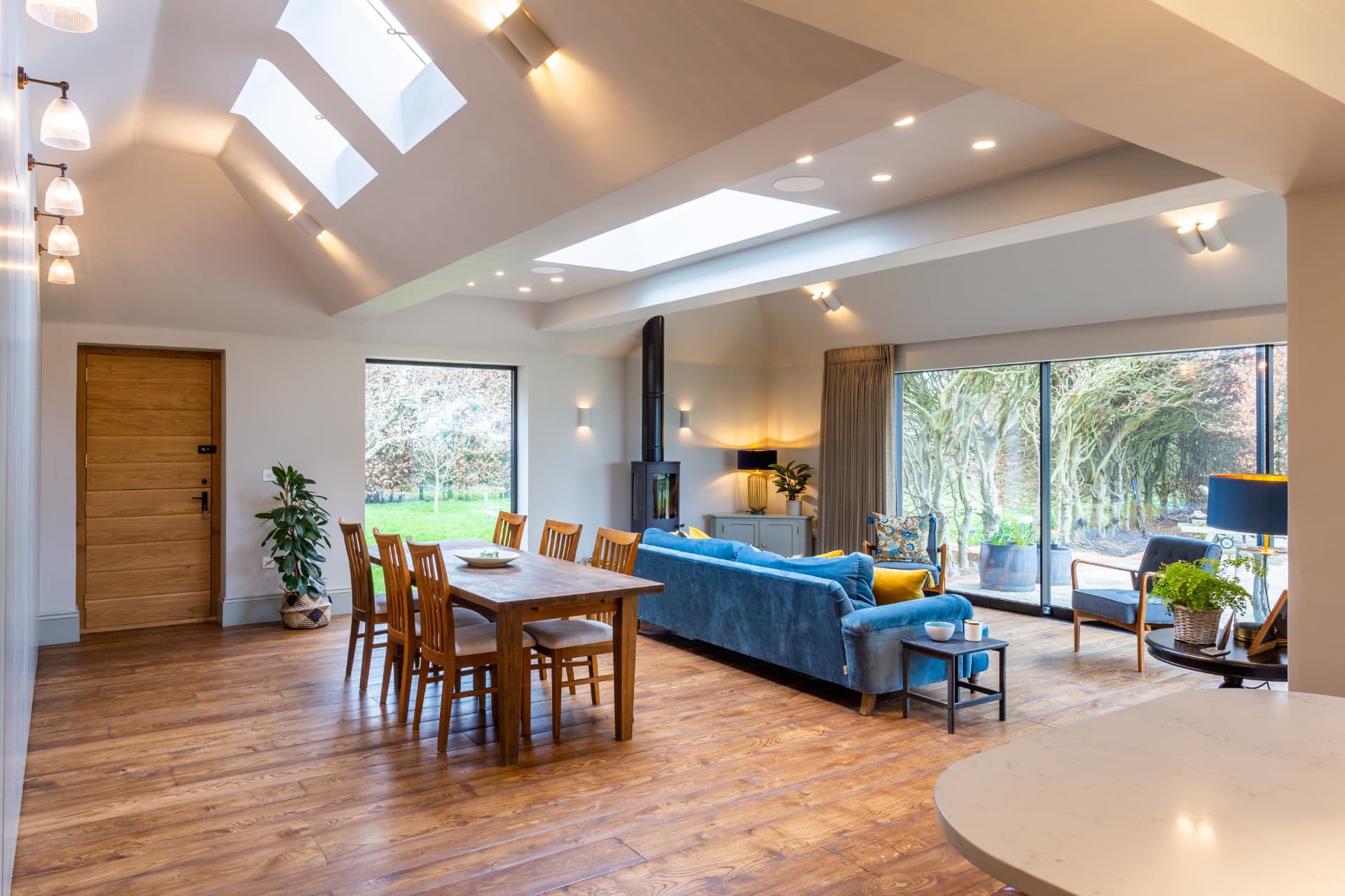 Bright open-plan living and dining space with fitted oak flooring
